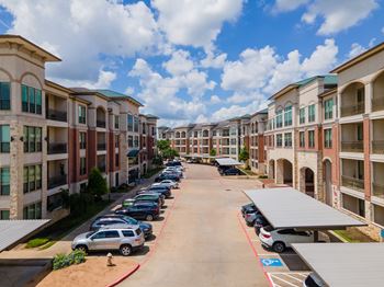 Apartment buildings with parking lot in front